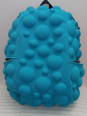 Vibrant blue MadPax Bubble Backpack featuring a unique 3D bubble design.